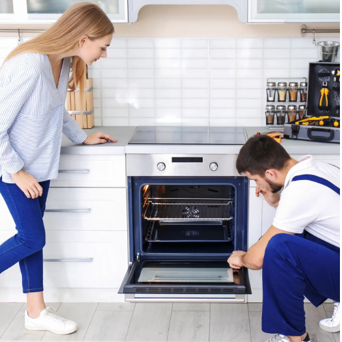 Technician providing oven and stove repair Buffalo NY kitchen